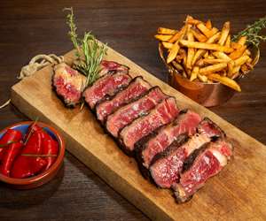Steak cooked rare with fries