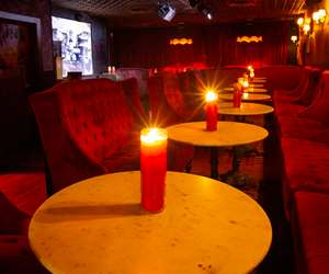 Table decorated with red candles