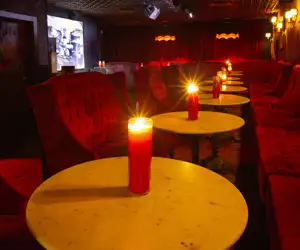 Table decorated with red candles