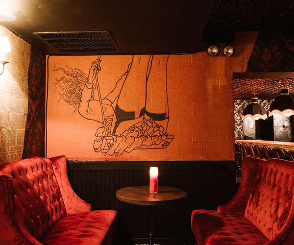 Bar booth beneath mural