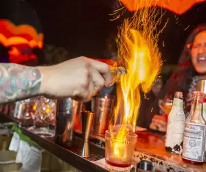 Flaming drink and excited guest